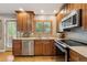 Kitchen with stainless steel appliances, granite countertops, and a view to the backyard at 12752 W Asbury Pl, Lakewood, CO 80228