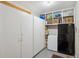 Storage room with lots of storage cabinets, shelving and two fridges at 12752 W Asbury Pl, Lakewood, CO 80228