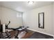 Workout room with hardwood floors and fitness equipment at 12752 W Asbury Pl, Lakewood, CO 80228
