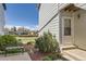 Inviting entrance with a cozy bench, well-kept landscaping, and a welcoming door, creating a charming curb appeal at 1351 S Cathay Ct # 102, Aurora, CO 80017