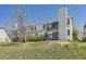Exterior view of a building featuring multiple balconies and neutral-colored siding at 1351 S Cathay Ct # 102, Aurora, CO 80017