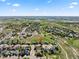 Expansive aerial view showing the neighborhood, local parks, and nearby lakes at 12972 Uinta Ct, Thornton, CO 80602