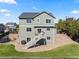 Back exterior showing the home's multi-level deck and landscaped yard at 12972 Uinta Ct, Thornton, CO 80602