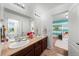 Bathroom with a double sink and decorative flowers at 12972 Uinta Ct, Thornton, CO 80602