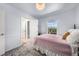 Bright and spacious bedroom with a window view and open doorway at 12972 Uinta Ct, Thornton, CO 80602