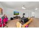 Large bonus room with a TV area and exercise equipment at 12972 Uinta Ct, Thornton, CO 80602