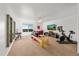 Spacious bonus room with exercise equipment and natural light at 12972 Uinta Ct, Thornton, CO 80602