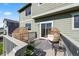 Relaxing outdoor deck area with wicker furniture and stylish decor at 12972 Uinta Ct, Thornton, CO 80602