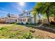 Landscaped backyard with lawn, garden beds, storage shed, and fenced perimeter at 9805 Garrison Ct, Broomfield, CO 80021