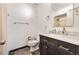 Classic bathroom with marble vanity, neutral walls, dark accents and a large shower-tub combo at 9805 Garrison Ct, Broomfield, CO 80021