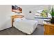 Cozy bedroom features plush carpeting, a sunny window, and a traditional wooden headboard at 9805 Garrison Ct, Broomfield, CO 80021