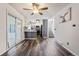 Bright dining area with wood floors, a ceiling fan, and glass doors to the outside at 9805 Garrison Ct, Broomfield, CO 80021