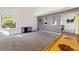 Spacious living room with a window, plush carpet, and open access to other rooms at 9805 Garrison Ct, Broomfield, CO 80021