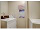 Community laundry room with washers, dryers, and posted usage instructions at 1050 N Lafayette St # 408, Denver, CO 80218