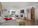 Bright living room featuring hardwood floors, a fireplace, and large windows for natural light at 1050 N Lafayette St # 408, Denver, CO 80218