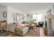 Bright living room with large sectional couch, stylish decor, and lots of natural light from the large windows at 1050 N Lafayette St # 408, Denver, CO 80218
