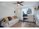 Multi-use room with a daybed and an office area featuring a desk, computer, and office chair at 1050 N Lafayette St # 408, Denver, CO 80218