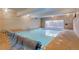 Indoor pool area with pool cover, clearly posted rules, and ample lighting at 1050 N Lafayette St # 408, Denver, CO 80218