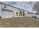 Backyard features a shed with concrete pad, and partially xeriscaped yard at 5547 Himalaya Rd, Denver, CO 80249