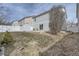 Backyard features storage shed, xeriscaped yard, and concrete patio at 5547 Himalaya Rd, Denver, CO 80249