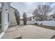 Large concrete patio area in the backyard for relaxing and entertaining at 5547 Himalaya Rd, Denver, CO 80249