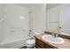Bathroom with shower over tub, single sink vanity, and updated faucet at 5547 Himalaya Rd, Denver, CO 80249