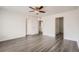 Bedroom with doorway to bathroom and durable gray flooring at 5547 Himalaya Rd, Denver, CO 80249