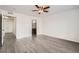 Bedroom with doorway to bathroom and durable gray flooring at 5547 Himalaya Rd, Denver, CO 80249