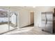 Kitchen featuring stainless steel refrigerator and sliding glass door leading to patio at 5547 Himalaya Rd, Denver, CO 80249