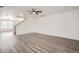 Bright, spacious living room with hardwood floors and neutral walls at 5547 Himalaya Rd, Denver, CO 80249