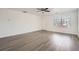 Bright living room featuring hardwood floors, neutral walls and a ceiling fan at 5547 Himalaya Rd, Denver, CO 80249