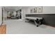 Large finished basement living space with gray carpet, pool table, and comfortable seating at 25312 E Glasgow Pl, Aurora, CO 80016