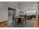 Bright dining area complemented by a modern kitchen with backyard views at 25312 E Glasgow Pl, Aurora, CO 80016