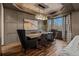Sophisticated dining room with a modern chandelier and beautiful wood table with seating at 25312 E Glasgow Pl, Aurora, CO 80016