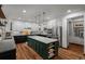 Well-appointed kitchen with a large island, stainless steel appliances, and ample cabinet space at 25312 E Glasgow Pl, Aurora, CO 80016