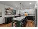 Stylish kitchen with an island, modern lighting, and stainless steel appliances at 25312 E Glasgow Pl, Aurora, CO 80016