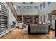 Spacious living room with high ceilings, built-in shelving, and large windows at 25312 E Glasgow Pl, Aurora, CO 80016