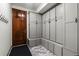 Mudroom with custom built-in cabinets, bench seating, and a tile floor at 25312 E Glasgow Pl, Aurora, CO 80016