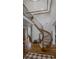 Grand foyer staircase with wood and wrought iron detailing and soaring ceilings at 25312 E Glasgow Pl, Aurora, CO 80016