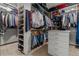 Organized walk-in closet with shelving, drawers, and hanging rods for maximum storage at 25312 E Glasgow Pl, Aurora, CO 80016