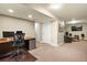 Spacious finished basement with an office area and a separate entertainment zone, ideal for versatile use at 11007 Meadowvale Cir, Highlands Ranch, CO 80130