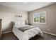 Bright bedroom with a large window and neutral tones creating a serene and inviting atmosphere at 11007 Meadowvale Cir, Highlands Ranch, CO 80130
