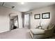 Bright bedroom with a large mirror, neutral decor, and cozy seating area at 11007 Meadowvale Cir, Highlands Ranch, CO 80130