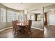 Cozy dining room with abundant natural light, stylish lighting, and a view to the living room at 11007 Meadowvale Cir, Highlands Ranch, CO 80130