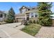 Charming two-story home with manicured front yard, stone accents, and a welcoming entrance at 11007 Meadowvale Cir, Highlands Ranch, CO 80130