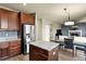 Stylish kitchen with stainless steel appliances, granite countertops, and an island, open to the living room at 11007 Meadowvale Cir, Highlands Ranch, CO 80130