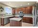 Bright kitchen showcasing granite countertops, stainless steel appliances, and ample cabinet space at 11007 Meadowvale Cir, Highlands Ranch, CO 80130