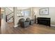 Bright living room with hardwood floors, comfortable seating, and elegant decor, perfect for relaxation at 11007 Meadowvale Cir, Highlands Ranch, CO 80130