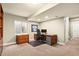 Functional office space in the basement with a built-in desk and mini-fridge, perfect for remote work at 11007 Meadowvale Cir, Highlands Ranch, CO 80130