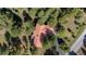 Stunning aerial view of the property showcasing its beautiful red tile roof and lush surroundings at 2235 Stonecrop Way, Golden, CO 80401